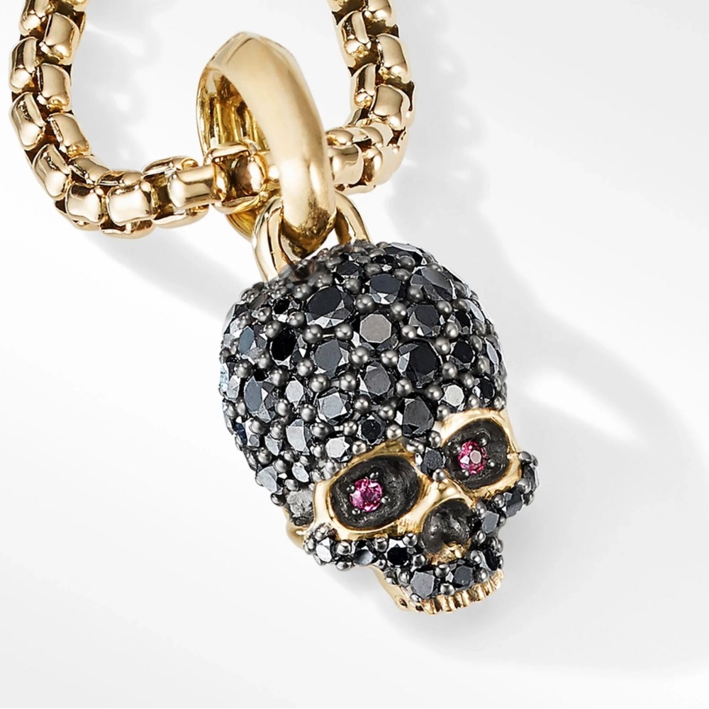 MEMENTO MORI SKULL AMULET WITH BLACK DIAMONDS, RUBIES AND 18K YELLOW GOLD